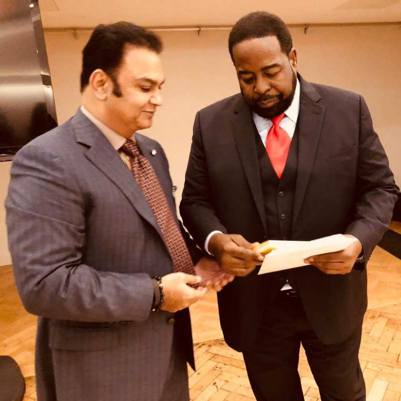 Professor Sarwar Khawaja presenting his bestselling book, The Teacher, to globally renowned motivational speaker, Les Brown_